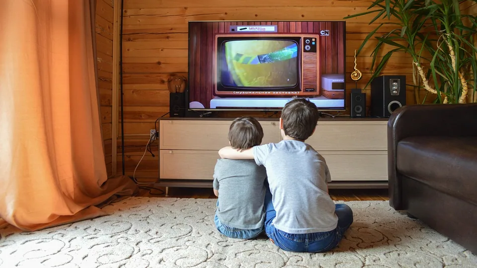 A television switched on in a room